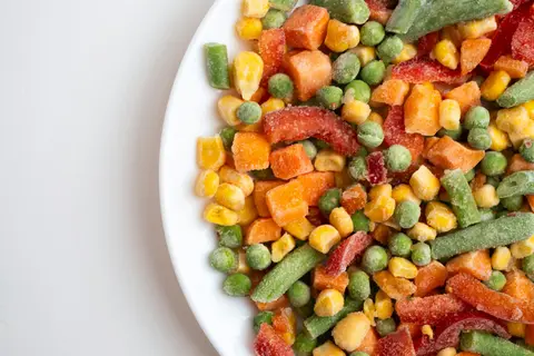 Frozen mixed vegetables including peas, carrots, corn and green beans